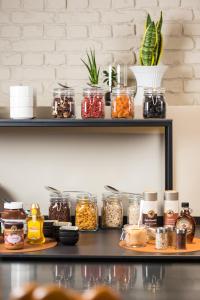 a shelf with jars of food on it at ibis Brussels Centre Chatelain in Brussels