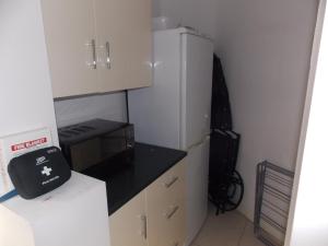 Η κουζίνα ή μικρή κουζίνα στο Waterside Apartment