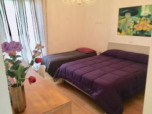 Postel nebo postele na pokoji v ubytování Guest House Le Acacie