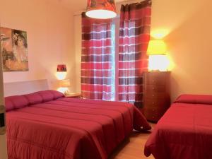 Postel nebo postele na pokoji v ubytování Guest House Le Acacie
