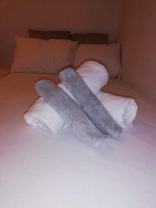 two towels on top of a bed at Central in Patra