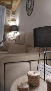 a living room with a couch and a table at Casa Rural Santana in Horta de San Joan