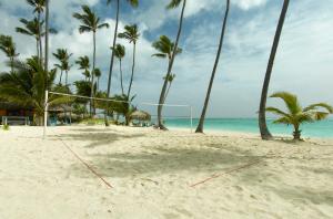 a beach with palm trees and palm trees at Grand Palladium Colonial Resort & Spa - All Inclusive in Akumal