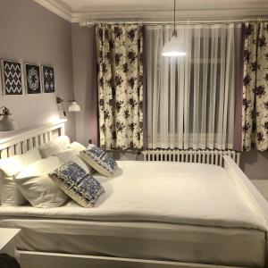 A bed or beds in a room at Mehmet Bey Suites