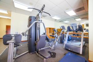 a gym with a bunch of tread machines in it at White Mountain Lodge #2329 in Mammoth Lakes