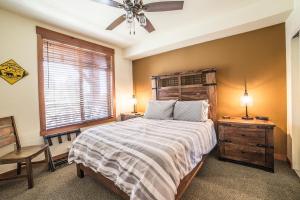 a bedroom with a large bed and a window at White Mountain Lodge #2329 in Mammoth Lakes +28 photos