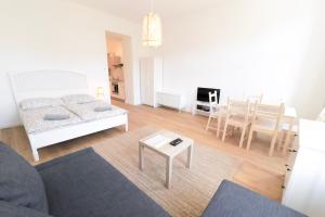 a living room with a couch and a table at Vienna City Apartments - Metro 1160 Vienna in Vienna