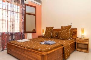 Tempat tidur dalam kamar di VILLA PHOEBE Cité BOAD Lomé Baguida
