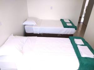 Postel nebo postele na pokoji v ubytování Pousada Pontal do Sul