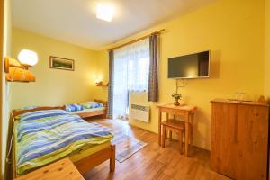 Postel nebo postele na pokoji v ubytování Penzion Pažický