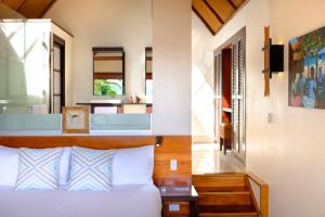 A bed or beds in a room at Royal Davui Island Resort, Fiji - Adults Only