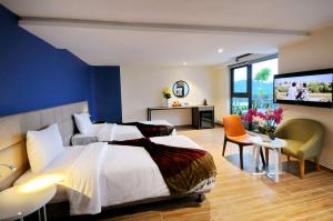 Giường trong phòng chung tại Anrizon Hotel Nha Trang