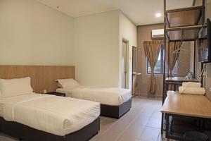 Postel nebo postele na pokoji v ubytování Hotel ali Imran