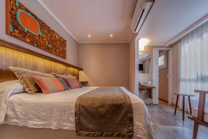 Una cama o camas en una habitación de Hotel Romina