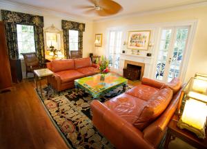 a living room with a couch and a table at The Gardens Hotel in Key West