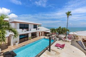 an aerial view of a house with a swimming pool and the ocean at Beluga Boutique Hotel in Lamai