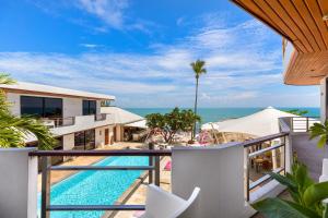 a view of the pool from the balcony of a villa at Beluga Boutique Hotel in Lamai