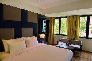 Postel nebo postele na pokoji v ubytování Hotel Ranjith