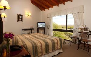 Cama ou camas em um quarto em Hotel Sierra Nevada