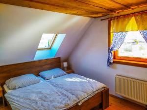 A bed or beds in a room at Zrub Liptovec