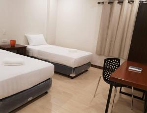Postel nebo postele na pokoji v ubytování Hotel Lourdes
