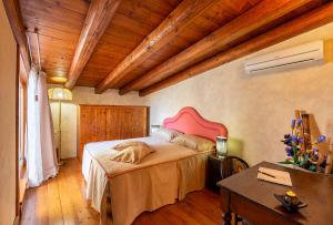 Voodi või voodid majutusasutuse Villa Maria Affittacamere toas