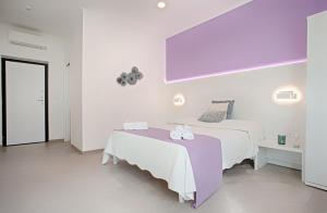 Postel nebo postele na pokoji v ubytování Collatina Suites