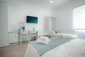 Postel nebo postele na pokoji v ubytování Collatina Suites