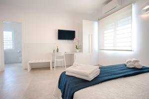 Postel nebo postele na pokoji v ubytování Collatina Suites