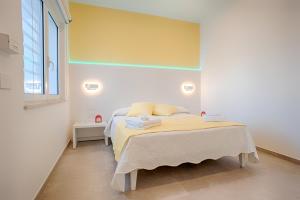 Postel nebo postele na pokoji v ubytování Collatina Suites
