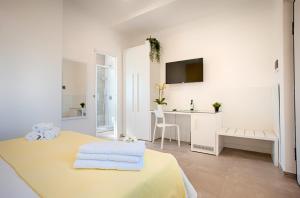 Postel nebo postele na pokoji v ubytování Collatina Suites
