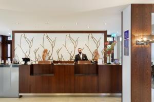 Členové personálu v ubytování ACHAT Hotel München Süd