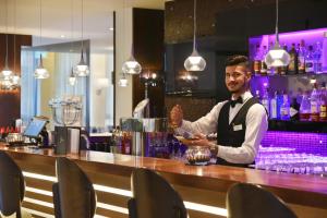 Nápoje v ubytování ACHAT Hotel München Süd