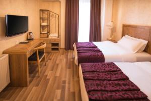 Postel nebo postele na pokoji v ubytování Ornament Boutique Hotel
