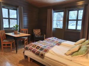 Postel nebo postele na pokoji v ubytování Gargia Lodge