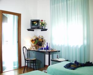 Postel nebo postele na pokoji v ubytování Hotel Paradiso