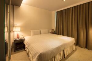 Finders Hotel-Fu Qian客房内的一张或多张床位