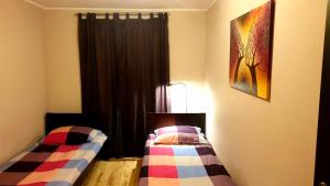 
Łóżko lub łóżka w pokoju w obiekcie Apartament Mozaika
