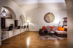 a living room with a couch and a table at Cernobbio Art Apartment in Cernobbio