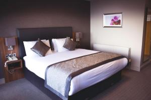 Voodi või voodid majutusasutuse Allingham Arms Hotel toas