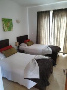 Ein Bett oder Betten in einem Zimmer der Unterkunft Dream Villa with private pool at Tortuga Beach Resort