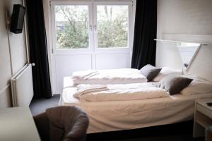 Dolphin Hotel Herning客房内的一张或多张床位