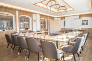 a conference room with a long table and chairs at Hotel & Gasthof Wagner in Aichach