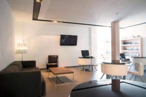 TV a/nebo společenská místnost v ubytování Hotel Sercotel Plana Parc