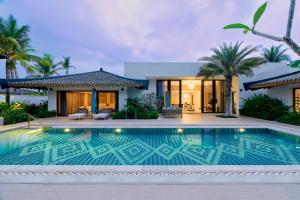 The swimming pool at or close to Capella Tufu Bay, Hainan