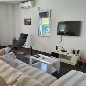 Telewizja i/lub zestaw kina domowego w obiekcie Villa Tea