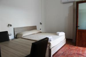 Postel nebo postele na pokoji v ubytování Room and Breakfast I Gemelli