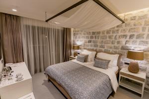 Ένα ή περισσότερα κρεβάτια σε δωμάτιο στο Boutique Hotel & Spa Casa del Mare - Mediterraneo