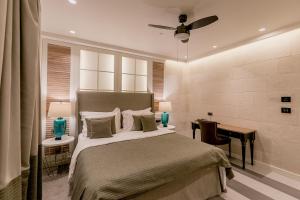 Ένα ή περισσότερα κρεβάτια σε δωμάτιο στο Boutique Hotel & Spa Casa del Mare - Mediterraneo