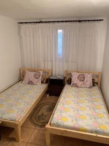 Postel nebo postele na pokoji v ubytování Casa Pitaru